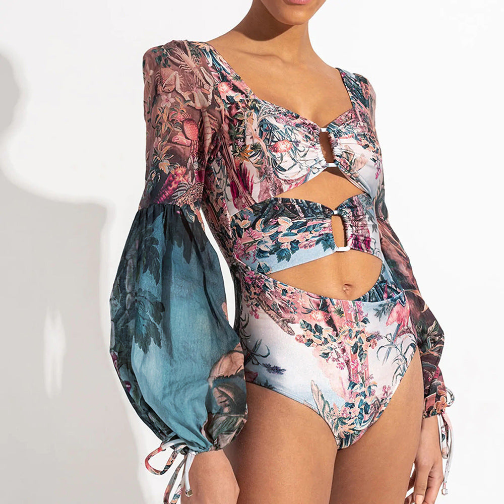 Dame én-delt badeshorts med glamorøs cut-out-design og elegante puffærmer Stilla