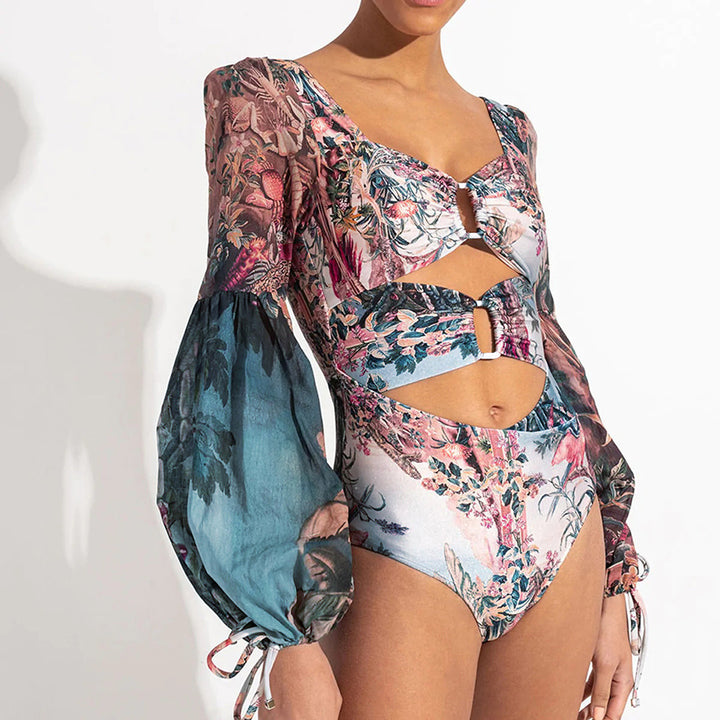 Dame én-delt badeshorts med glamorøs cut-out-design og elegante puffærmer Stilla