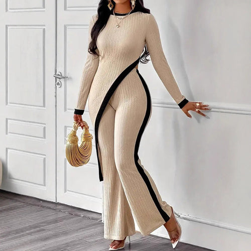 Kvinders stilfulde jumpsuit med asymmetrisk design og kontrasterende piping Stilla