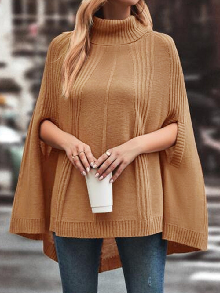 Dame strik poncho med høj hals og struktureret design Stilla