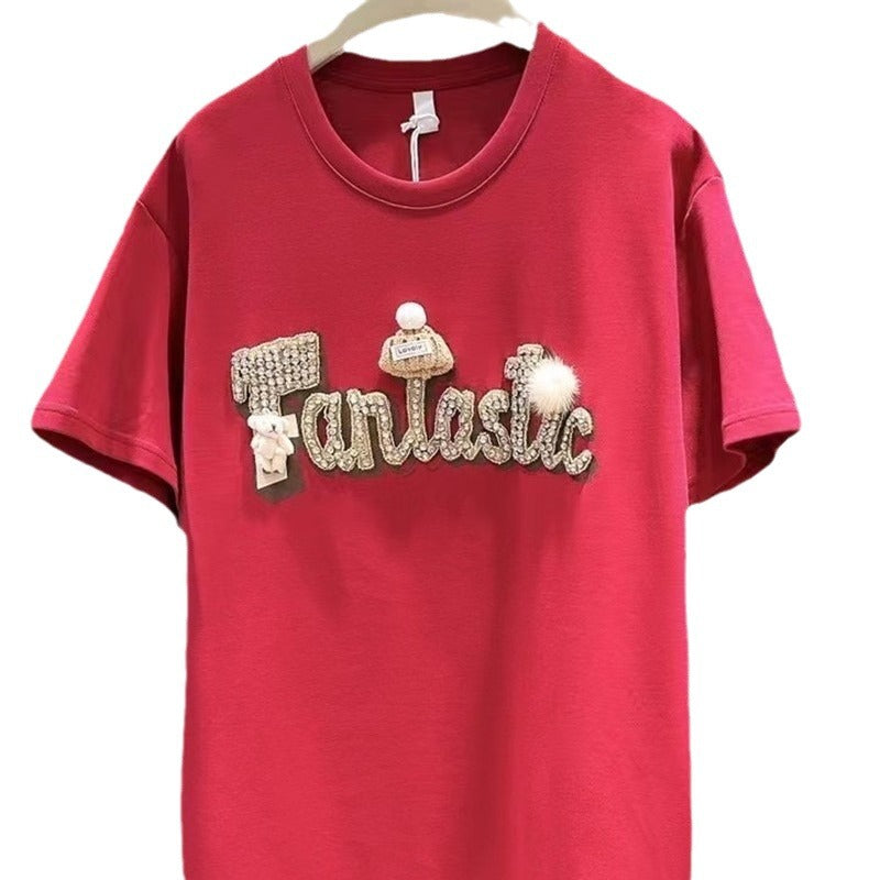 Dame T-shirt med stilfuld skrift og iøjnefaldende applikationer Stilla