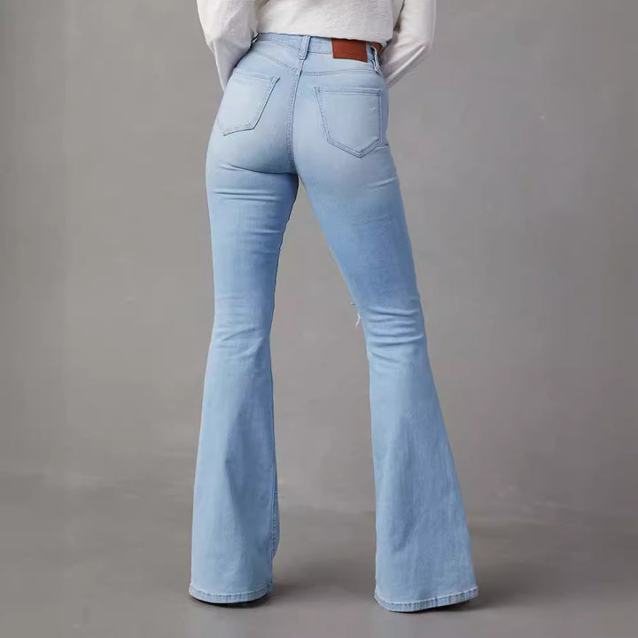 Kvinde bell jeans med trendy slidte detaljer og høj talje Skovae