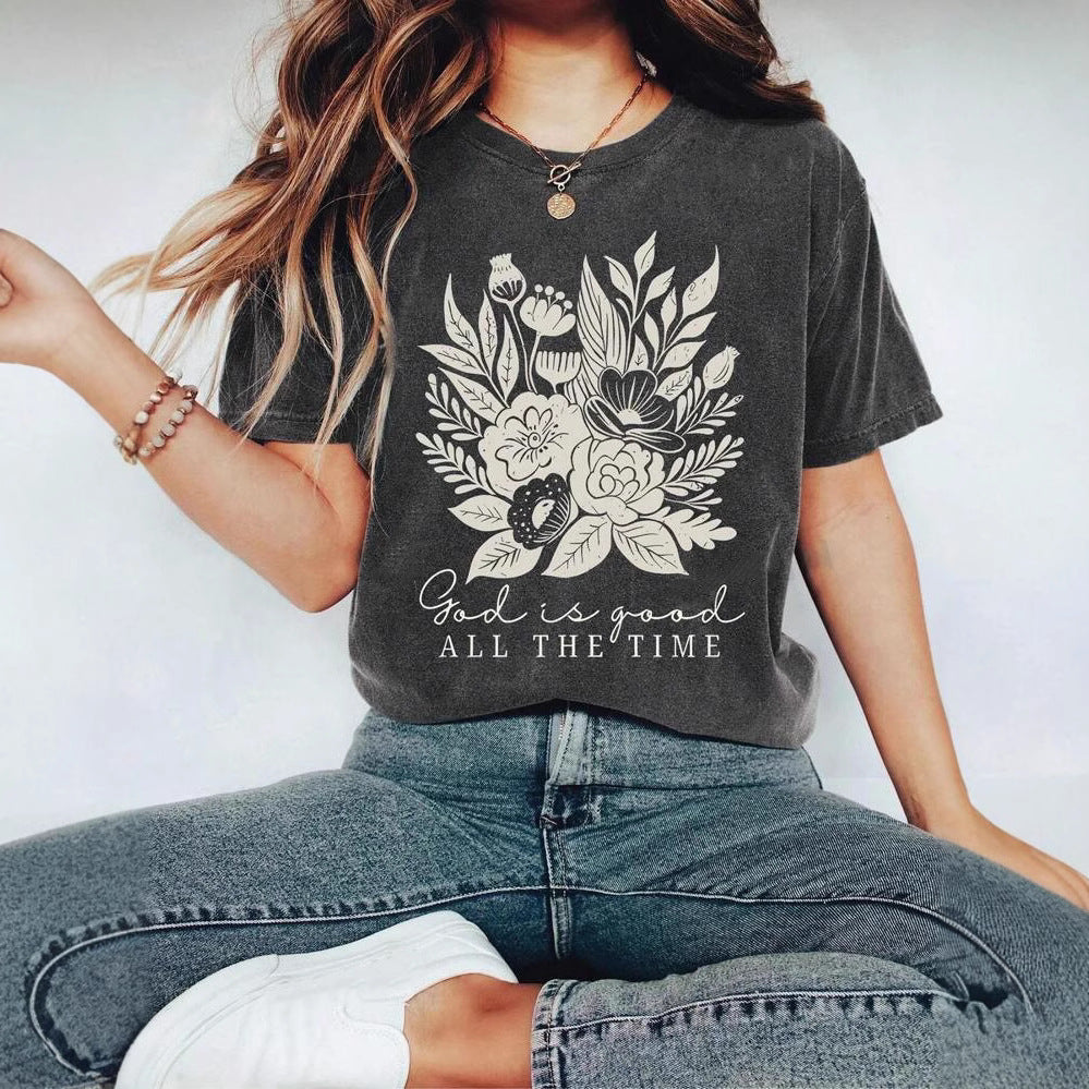 Dame T-shirt med floralt motiv og inspirerende tekst Stilla