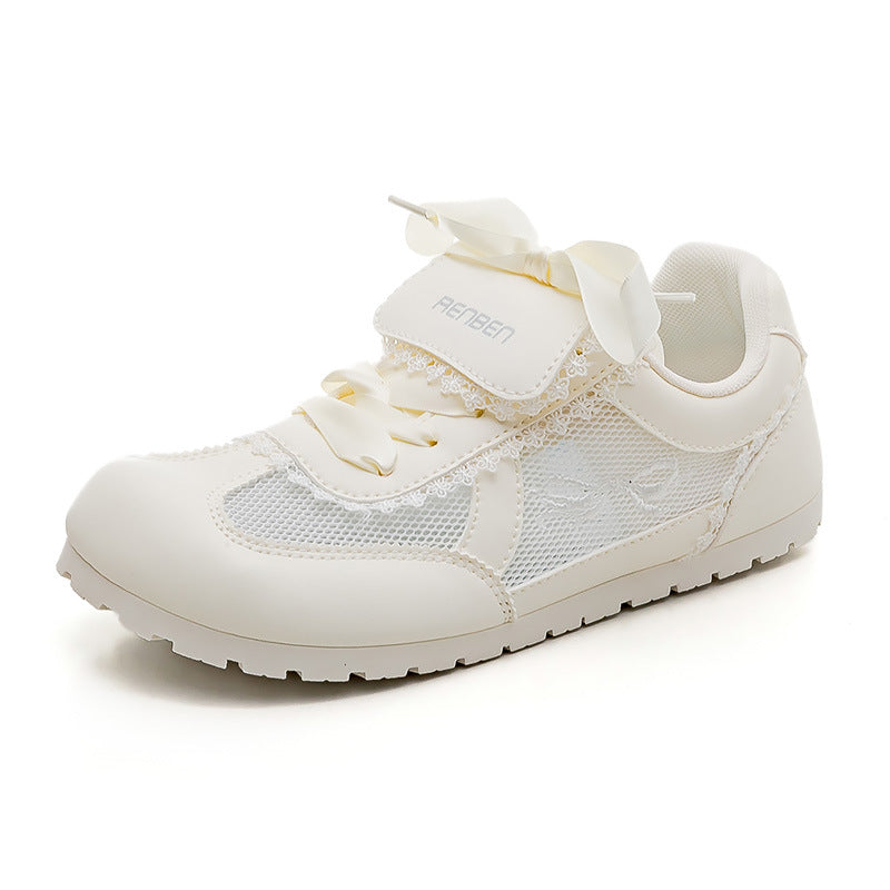 Dame Sneakers i romantisk design med dekorative sløjfer og åndbart mesh-overflade Stilla