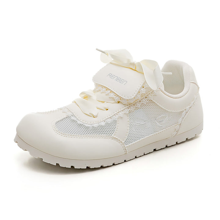 Dame Sneakers i romantisk design med dekorative sløjfer og åndbart mesh-overflade Stilla