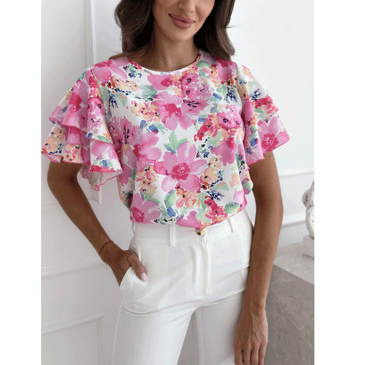 Damebluse med voluminøse flæseærmer og blomstermotiv Stilla