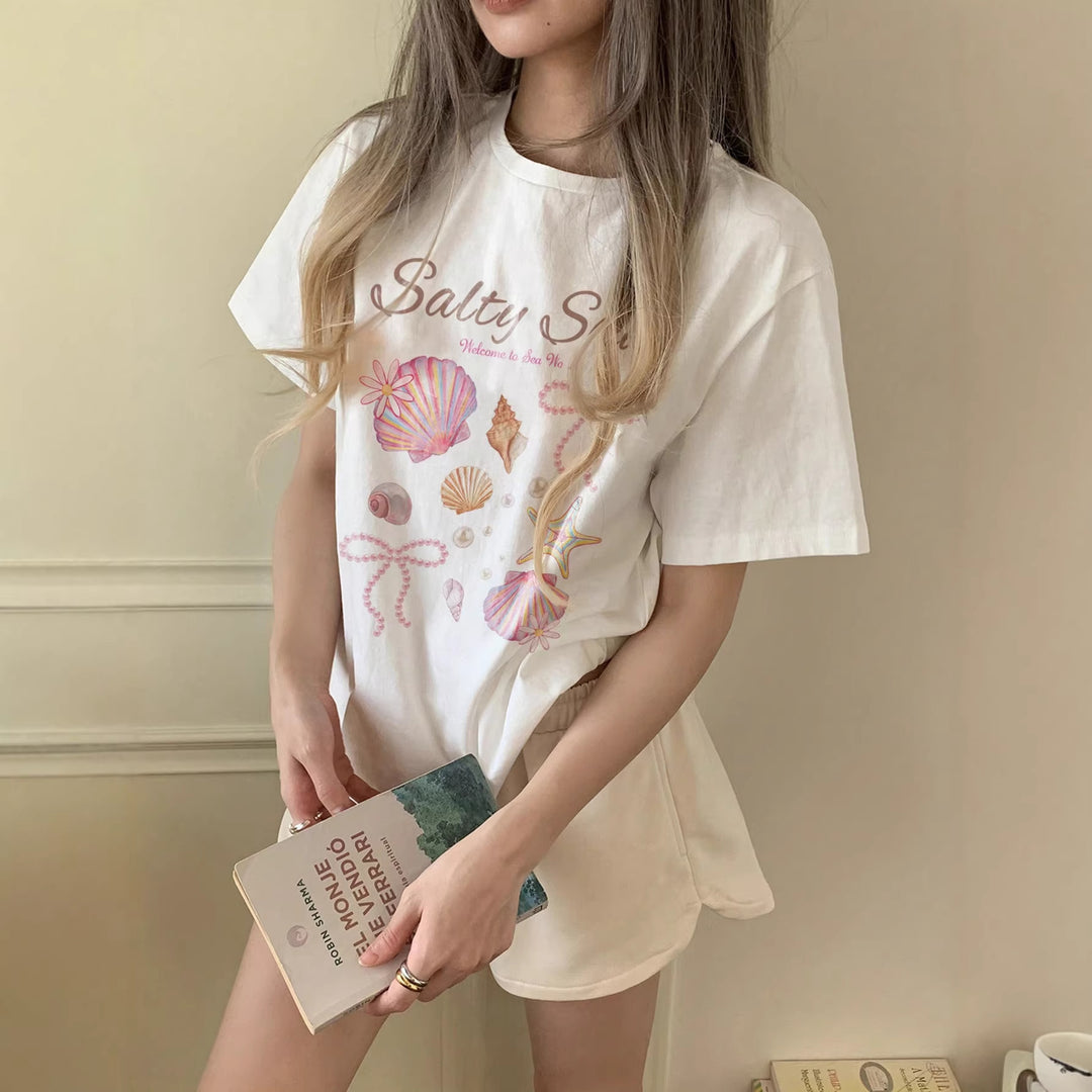 Dame Grafik T-shirt med maritimt muslingemotiv og afslappet snit Skovae