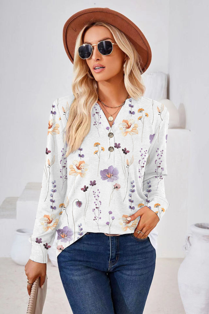 Damebluse med blomstret design og knapliste Stilla