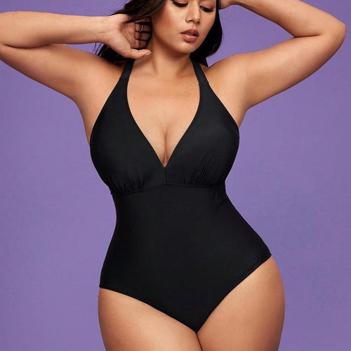 Dame one-piece badedragt med dyb V-udskæring og figurskabende design Skovae