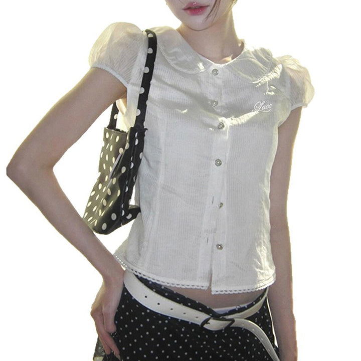 Dame figursyet bluse med elegant krave og knapdetaljer Skovae
