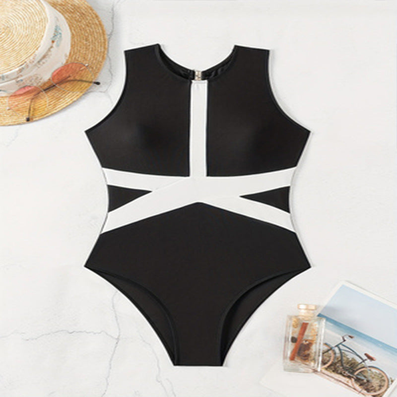 Dame enhed badedragt med sportslig lynlås og trendy grafisk design Skovae
