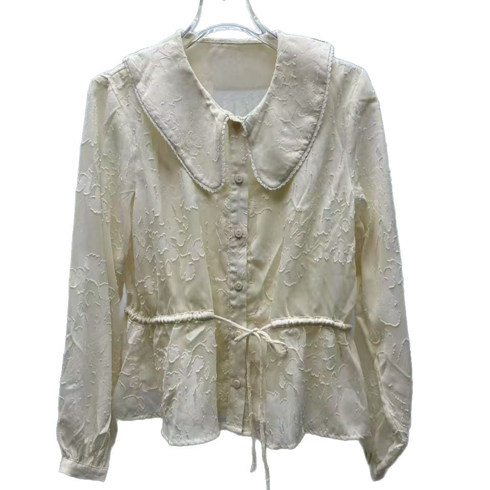 Damebluse med voluminøs krave og elastiske detalje i livet Stilla