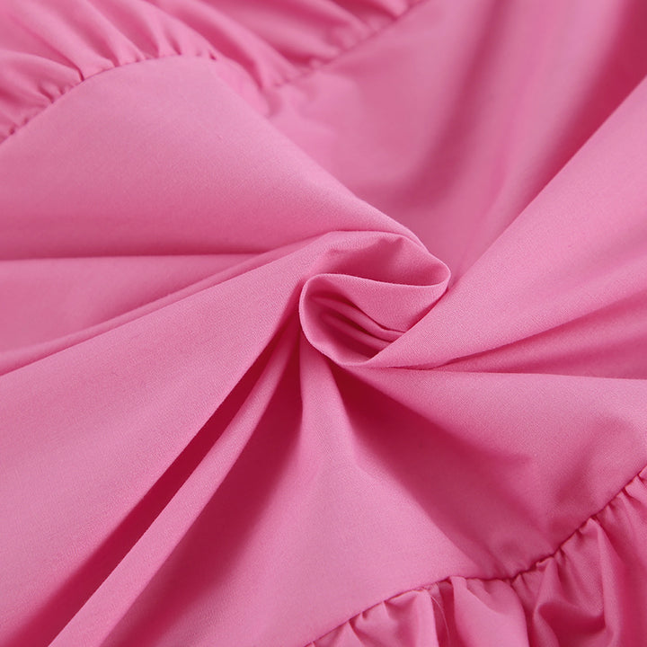 Damebluse med voluminøse rufflesdetaljer og elegante pufærmer Stilla
