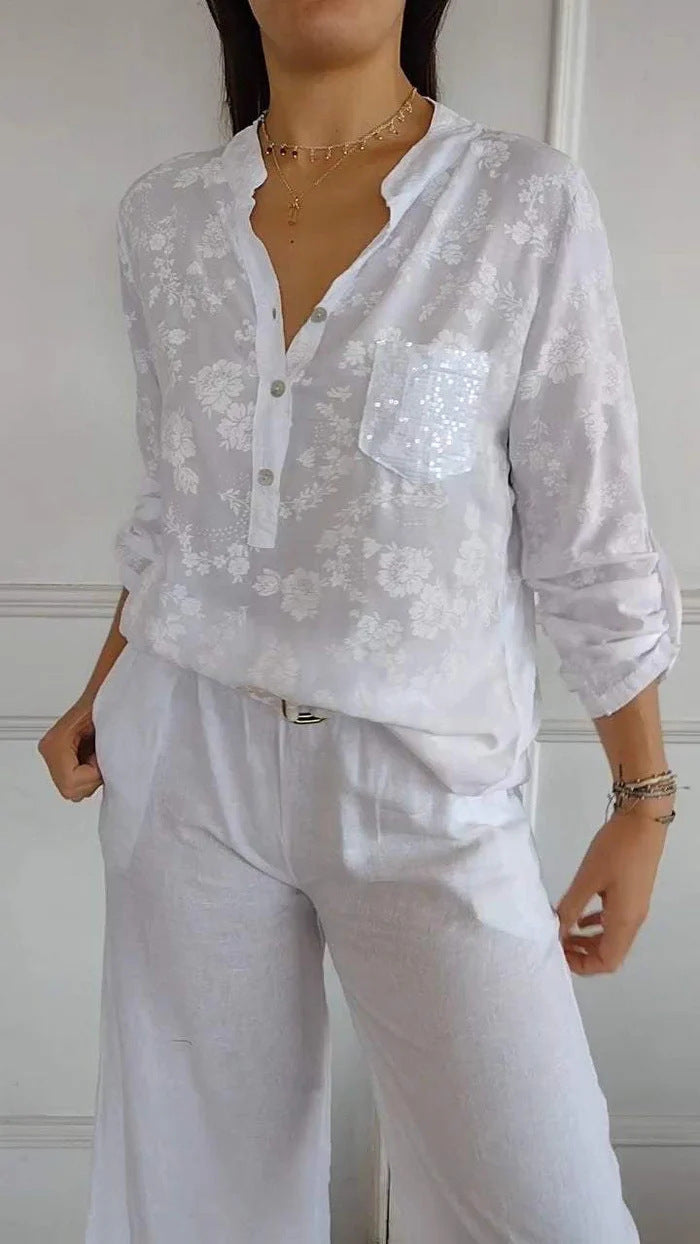 Damebluse med blomsterdesign og glitrende pailletter Stilla
