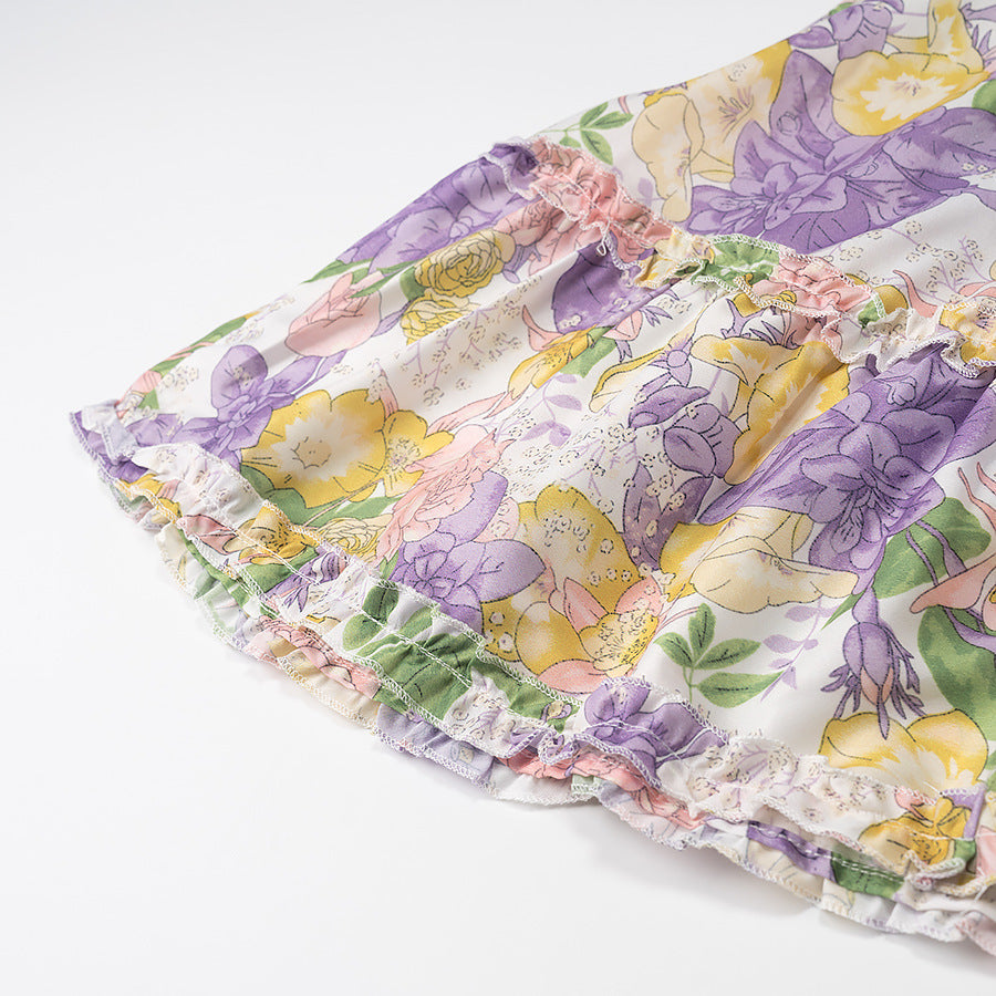 Dameviklekjole med blomsterdesign og flæsedetaljer Stilla