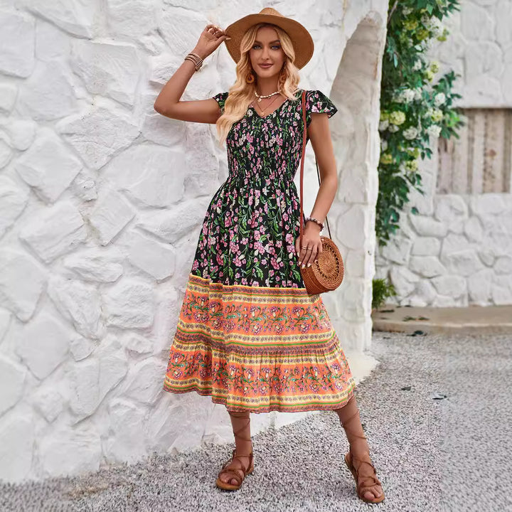 Dame midikjole i bohemian stil med patchwork-mønster og flydende skørt Stilla