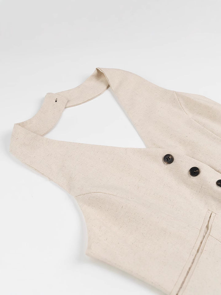 Dame jumpsuit med elegant V-udskæring og raffinerede knapdetaljer Stilla
