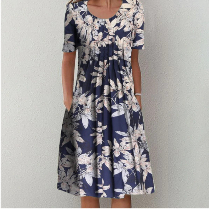 Dame fritidskjole med blomstret design og praktiske lommer Stiila