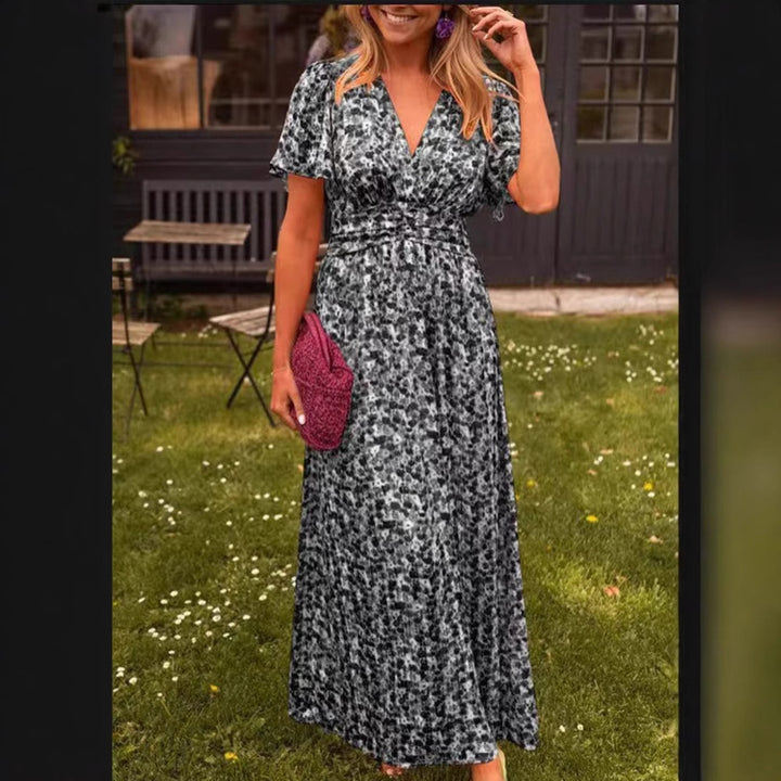Dame maxikjole med voluminøse ærmer og figursyet snit Stilla