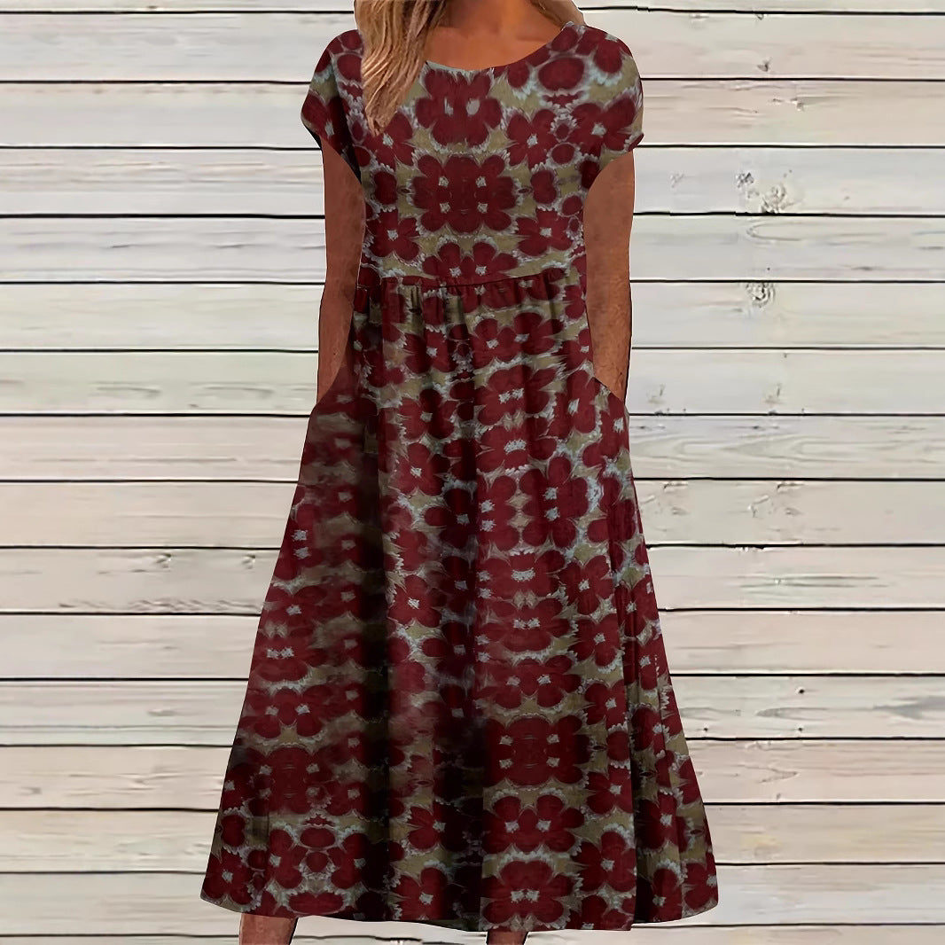 Dame Maxikjole med legende blomsterprint og praktiske sidelommer Stilla