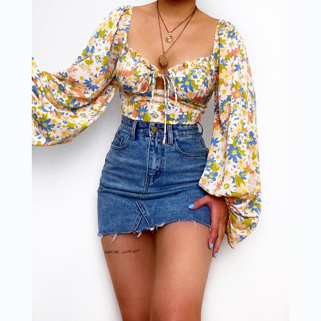 Kvinders bluse med puffærmer og blomsterprint Skovae