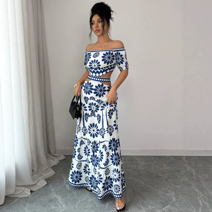 Dame maxikjole med blomstret design og trendy off-shoulder udskæring Skovae