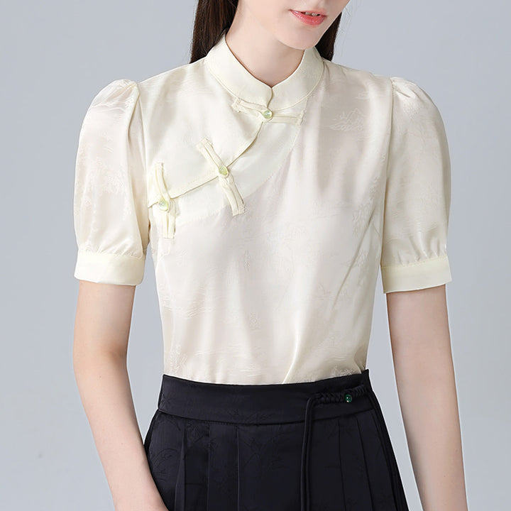 Damebluse med elegant ståkrave og kunstneriske knapdetaljer Stilla