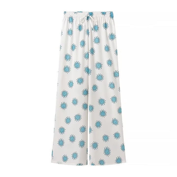 Dame sæt bestående af overdel og løst skåret bukser i floralt design Stilla