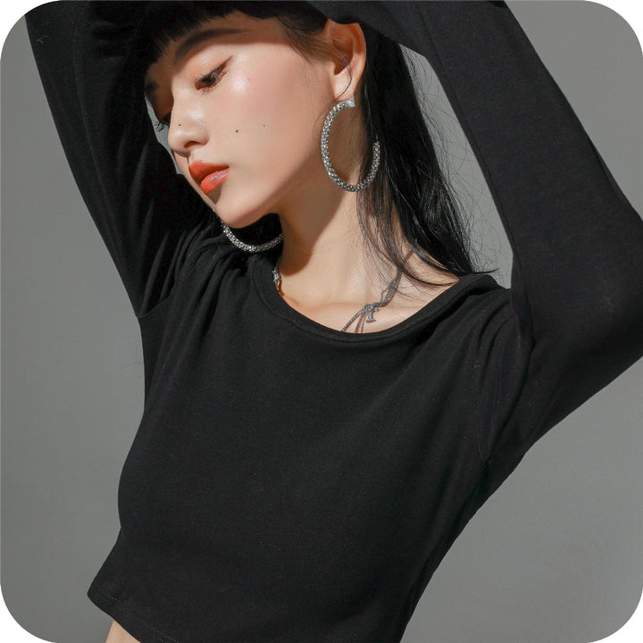 Dame figursyet langærmet crop-top i elastisk materiale med hudvenligt feel Stilla