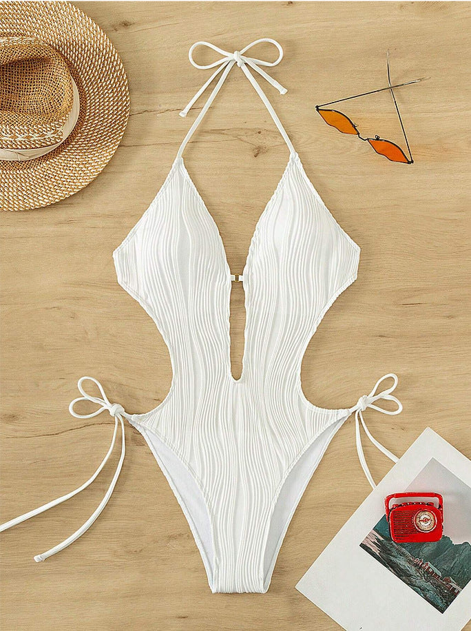 Dame one-piece badedragt med dyb udskæring og ribdesign Skovae