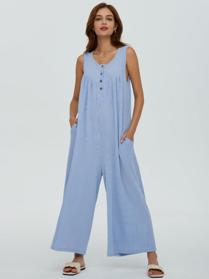 Dame afslappet jumpsuit med vidde ben og knapdetaljer Stilla
