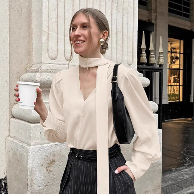 Dame elegant bluse med asymmetrisk binde detalje og voluminøse ærmer Stilla