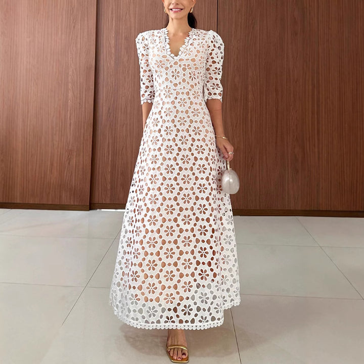Dame spids-maxikjole med gennembrudt design og elegante puffærmer Stiila