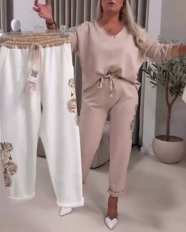 Kvinde sport outfit med dekorative blomsterprint og elastisk talje Stilla