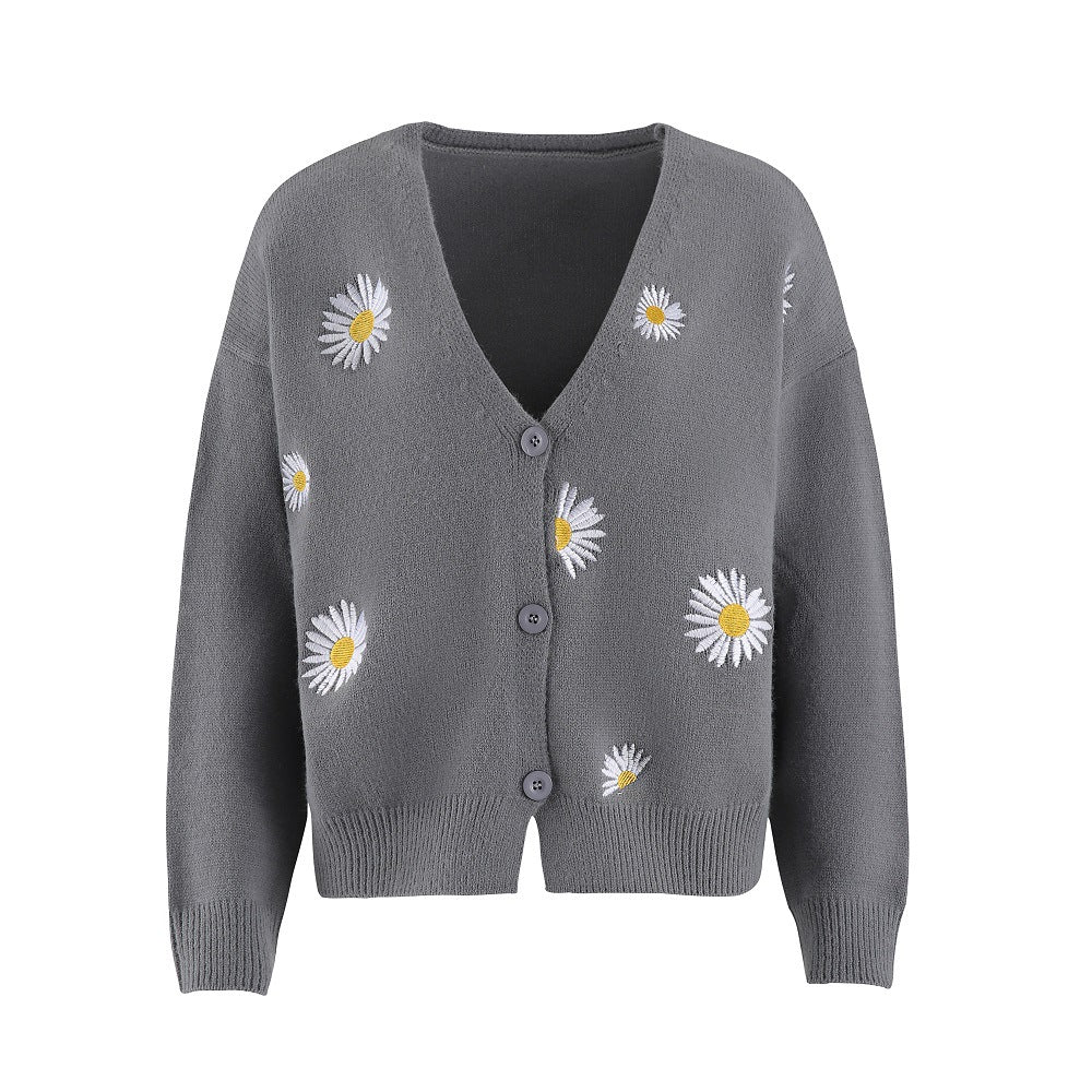 Dame strikjakke med blomsterdesign og knaplukning Stilla
