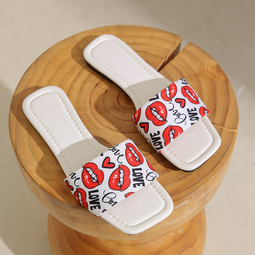 Dame slide-sandaler med trendy kys-motiv og behagelig sål Stilla