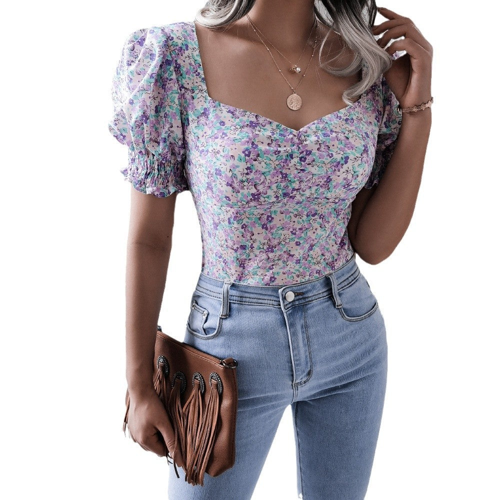 Damebluse i romantisk blomsterdesign med puffærmer Stilla