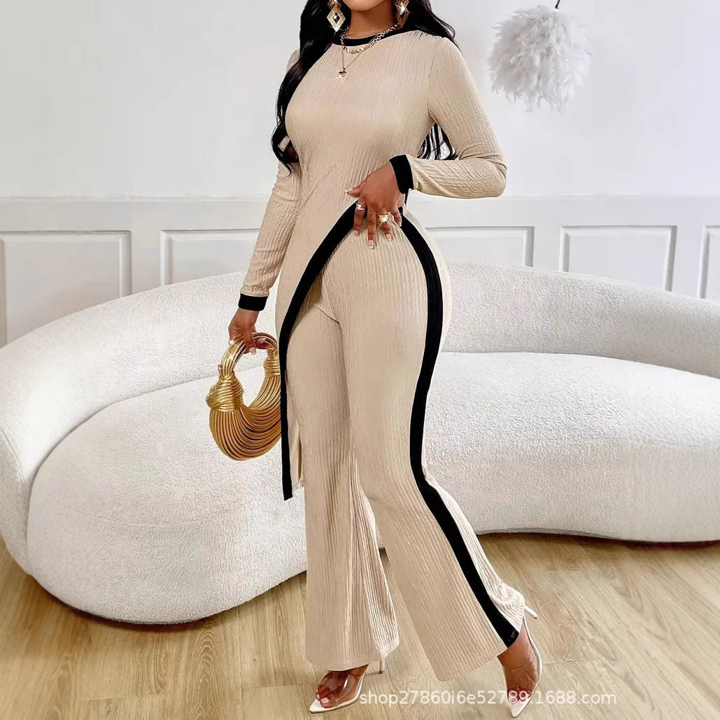 Kvinders stilfulde jumpsuit med asymmetrisk design og kontrasterende piping Stilla