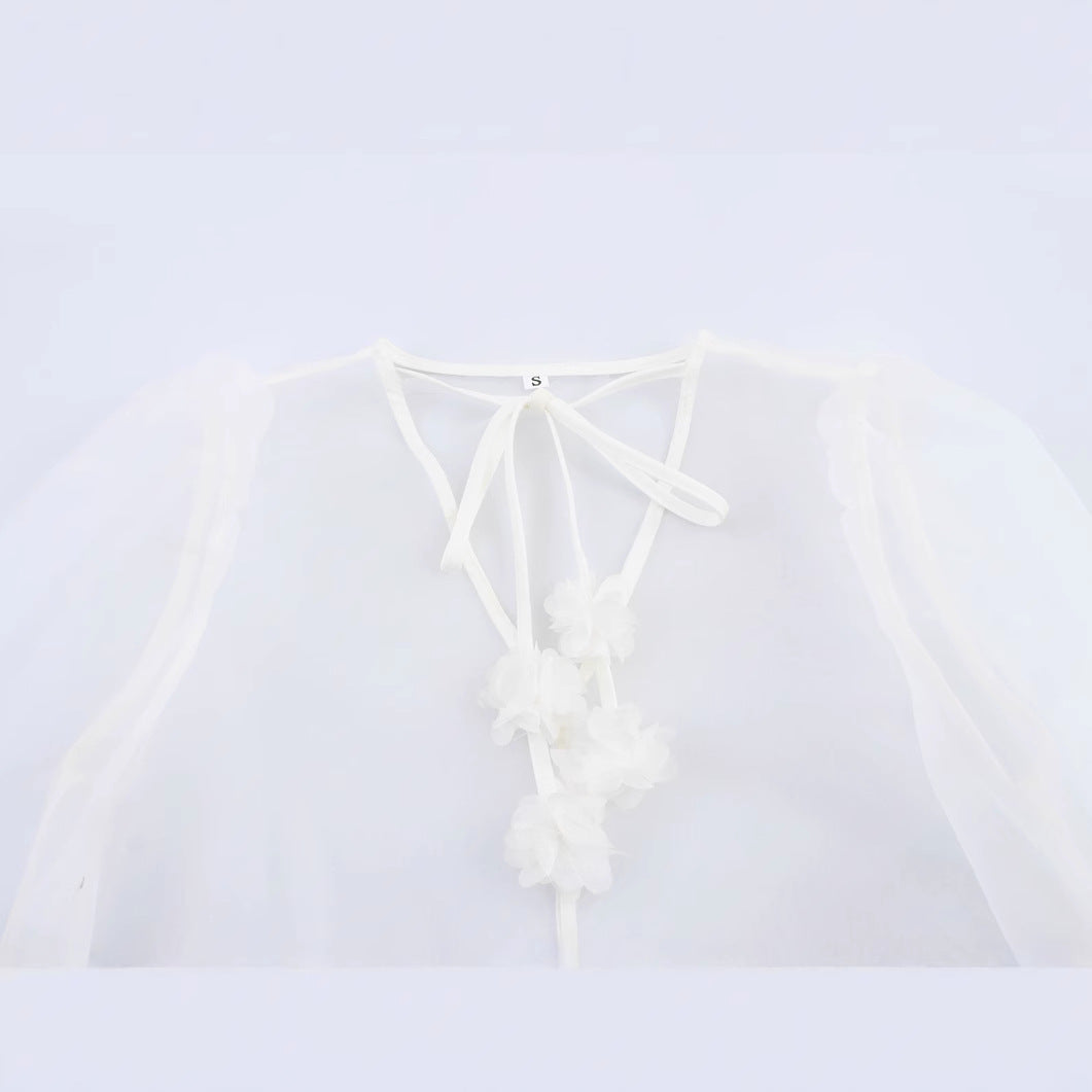 Femme Elegante Transparent Bluse med Puffærmer og Florale Accenter Stilla
