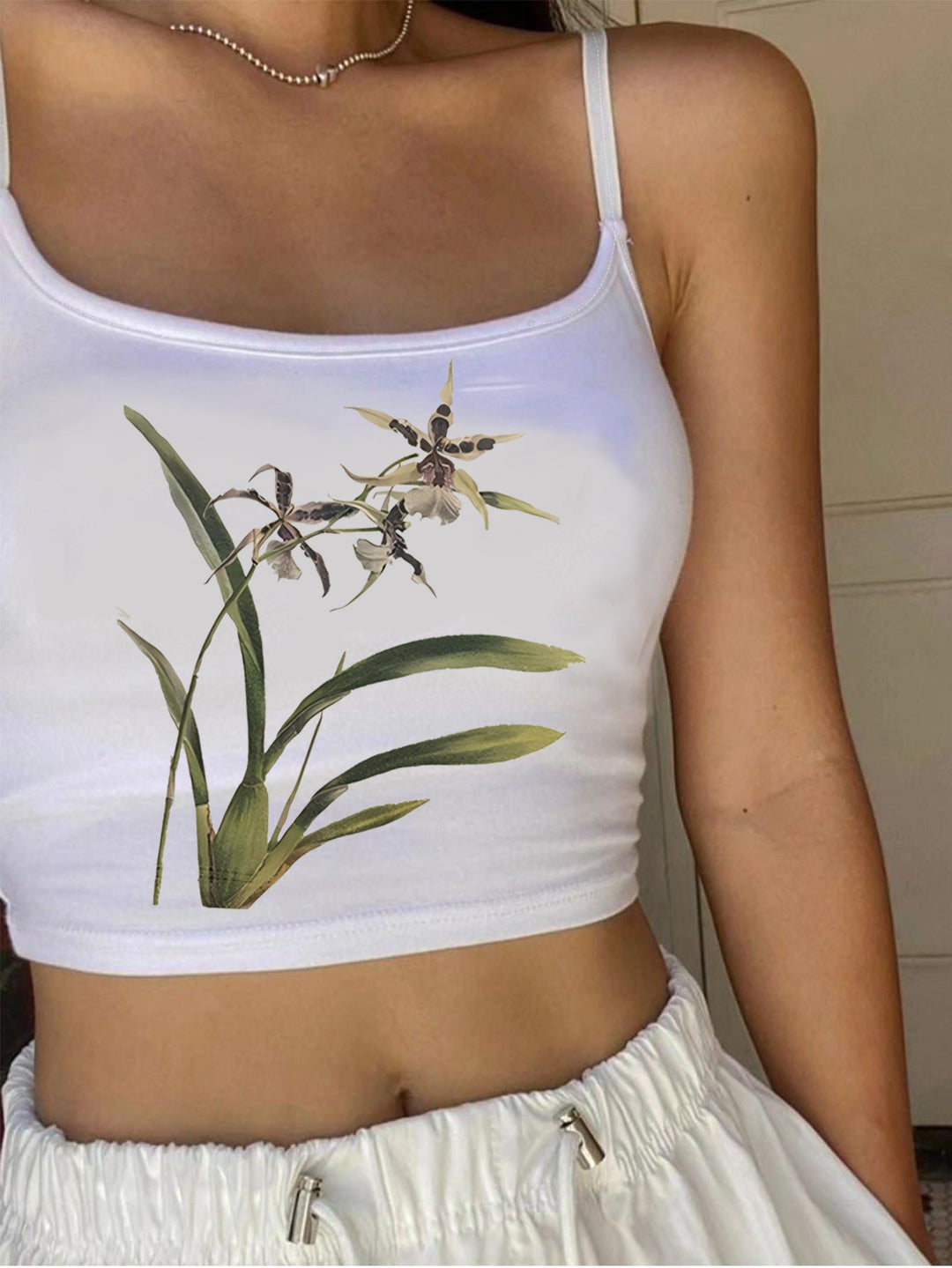 Dame Crop-Top med blomsterdesign og smalle stropper Skovae