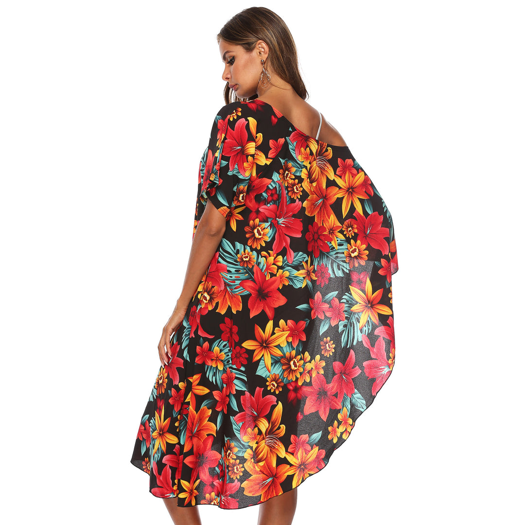 Dame Strandtunika med floral design og asymmetrisk skæring Stilla