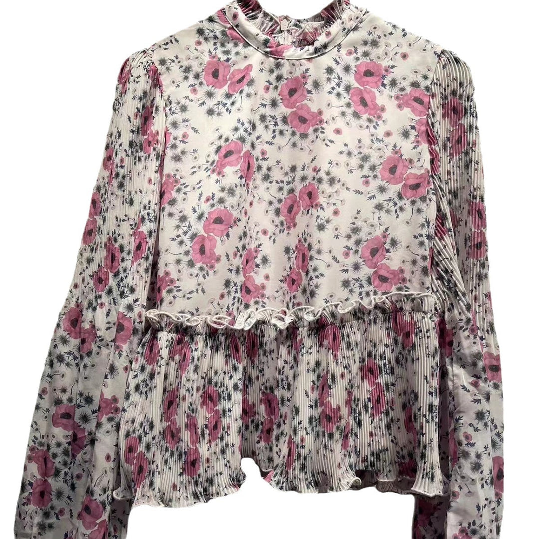 Damebluse med blomsterdesign og elegante plisséærmer Stilla