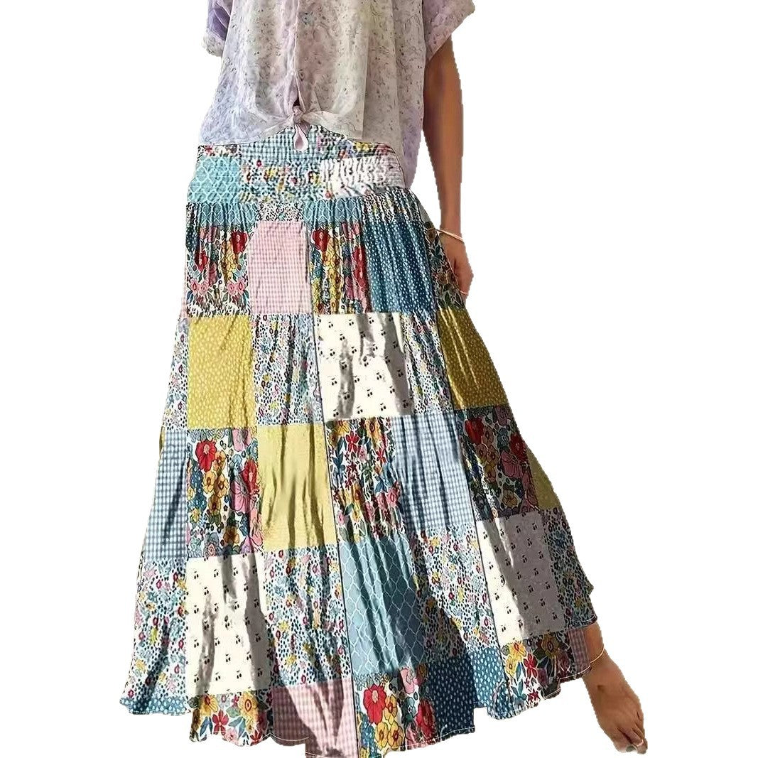 Dame maxikirtel i patchwork-design med elastisk talje og flydende snit Stilla