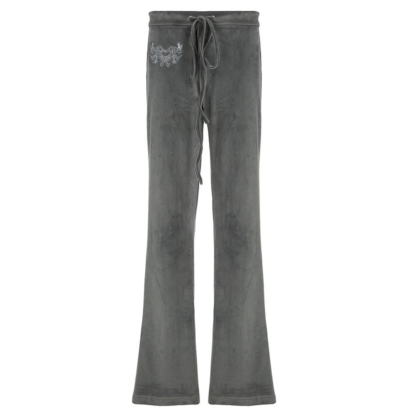 Dame-sweatpants i afslappet flared-design med trendy broderier Skovae