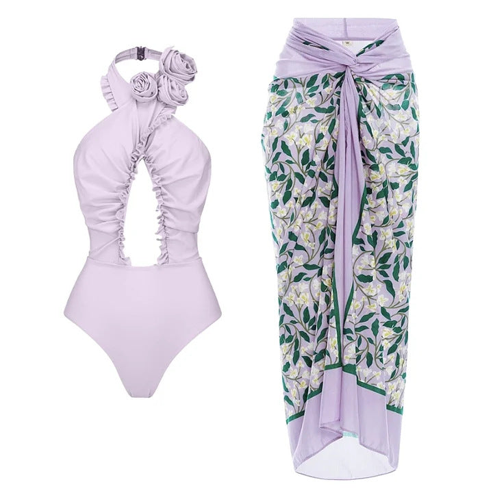 Dame svømmedragt med blomstret design og raffineret cut-out-look Skovae