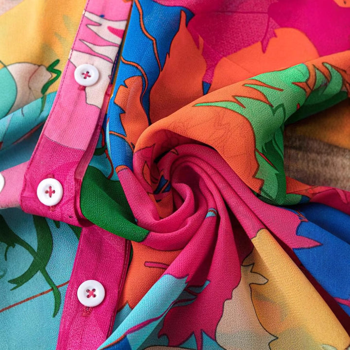 Damebluse med puffærmer og farverigt blomsterprint Stilla