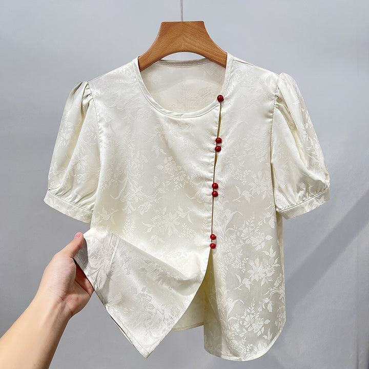 Damebluse med elegant struktur og dekorative knapper Stilla