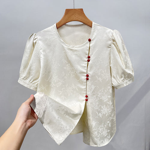 Damebluse med elegant struktur og dekorative knapper Stilla