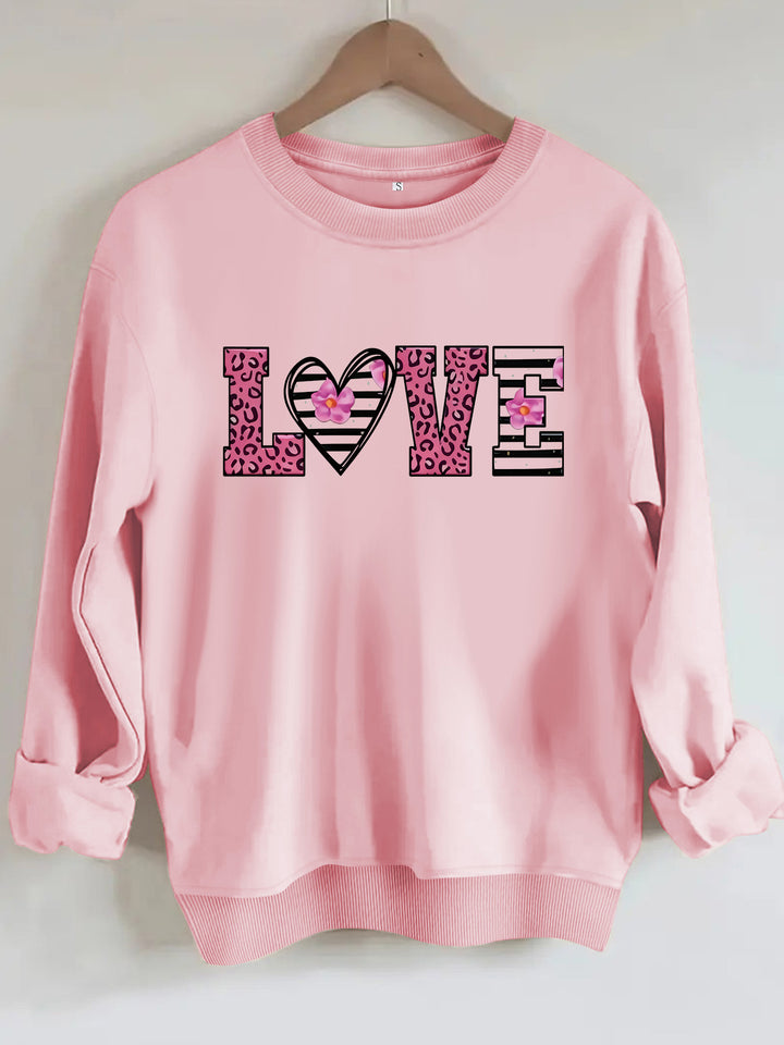 Kvinders sweatshirt med moderne leopard hjerte design og behagelig pasform Stilla