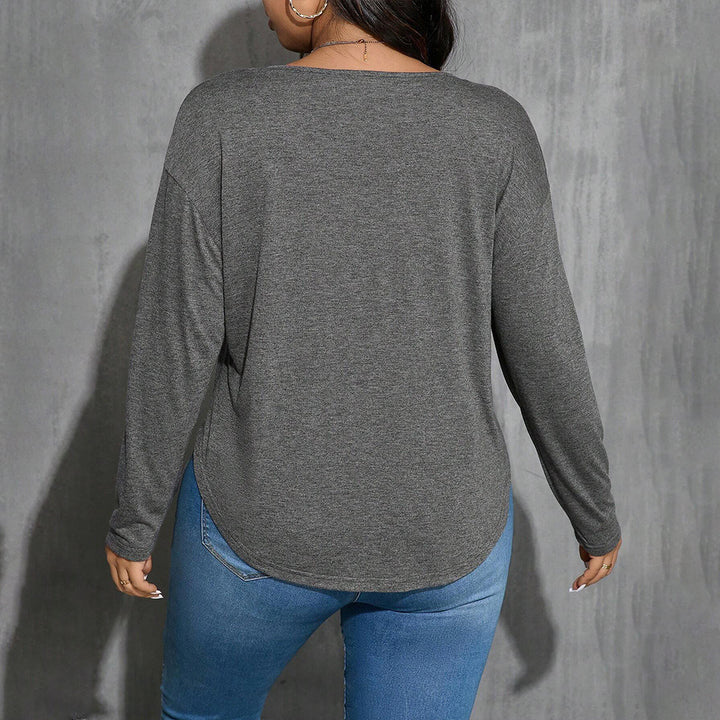 Dame afslappet longsleeve top med V-udskæring og let asymmetrisk kant Stilla